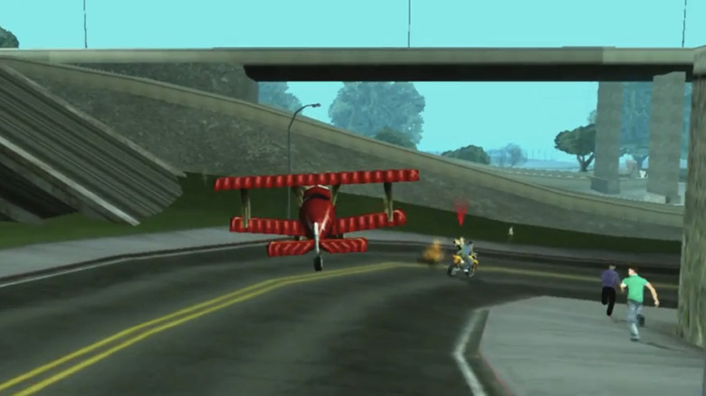 A remote controlled plan flies over a road in Grand Theft Auto San Andreas