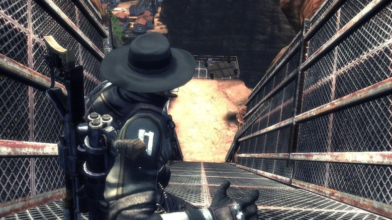 Hamilton Rourke slides down a walkway towards an explosion in Damnation