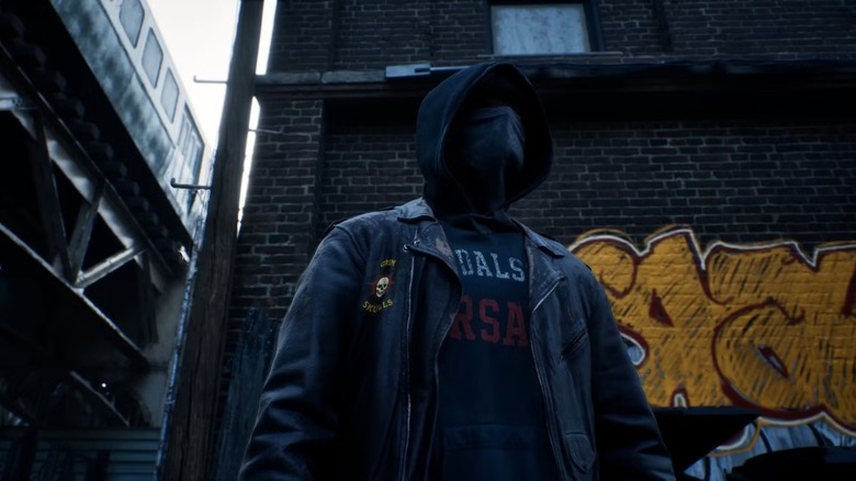 Samson McCray stands hooded and masked in an alley in Samson