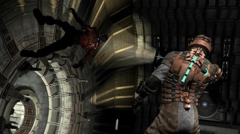 Isaac Clarke aims at a floating Necromorph in Dead Space (2008)