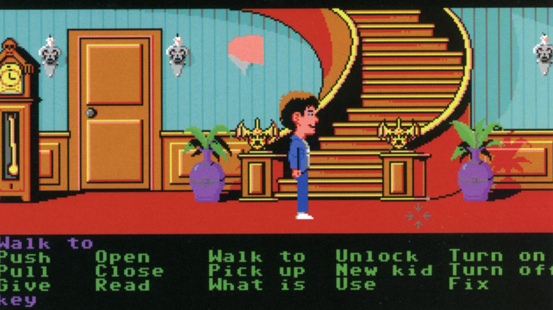Dave Miller stands at the foot of a staircase in Maniac Mansion