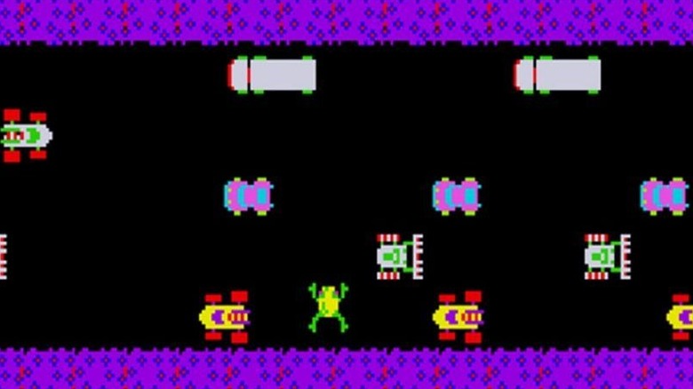 A frog moves between cars across a road in Frogger