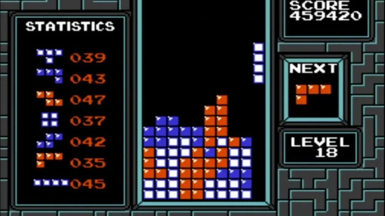 A long straight Tetris piece is on the far right side of a screen in "Tetris" (1989)