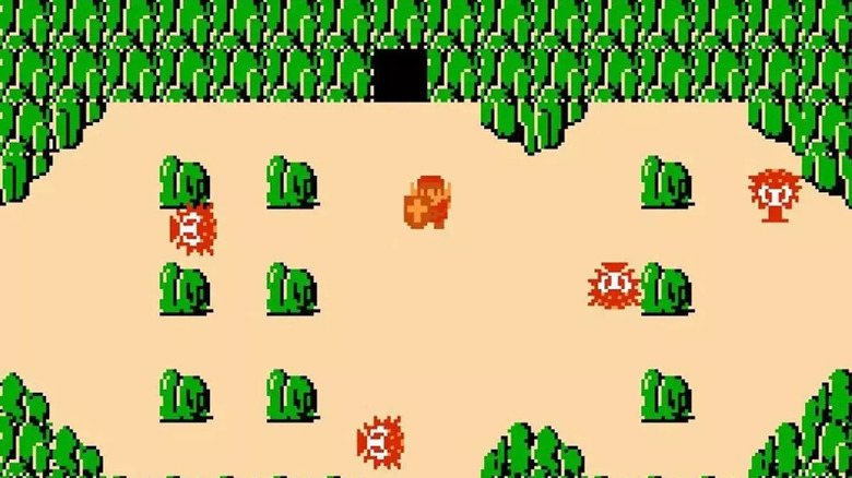Link is surrounded by Octoroks among boulders in "The Legend of Zelda" (1986)