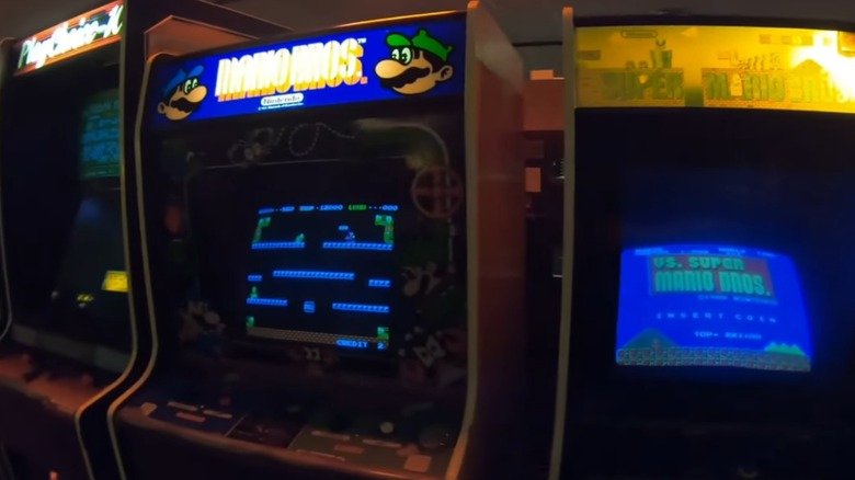 Three arcade cabinets lined up in a row