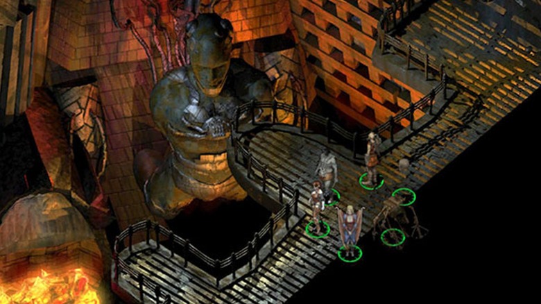 Party standing on balcony over giant statue