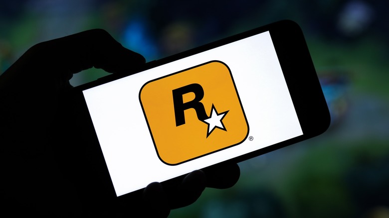 Rockstar Games logo on phone in dark