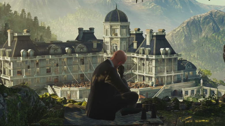 Agent 47 surveys a large chateau in Hitman 2