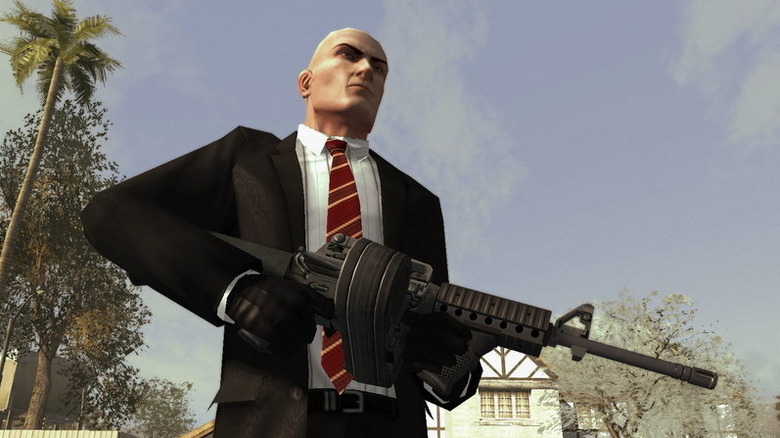 Agent 47 holds an assault rifle in Hitman: Blood Money