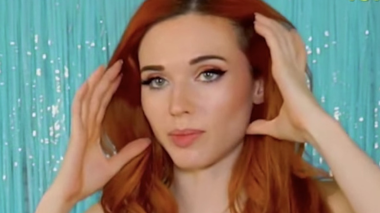 Amouranth with hand on head