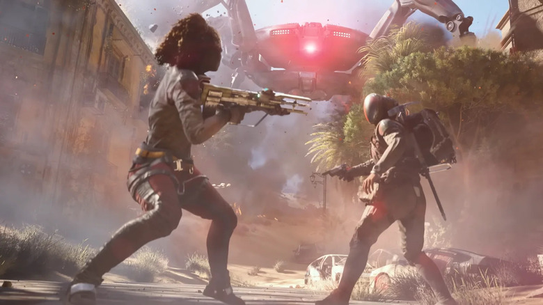 Two raiders face an incoming towering mechanical spider in ARC Raiders