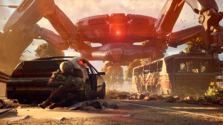 A raider hides behind a wrecked car as a mechanical spider looms overhead in ARC Raiders