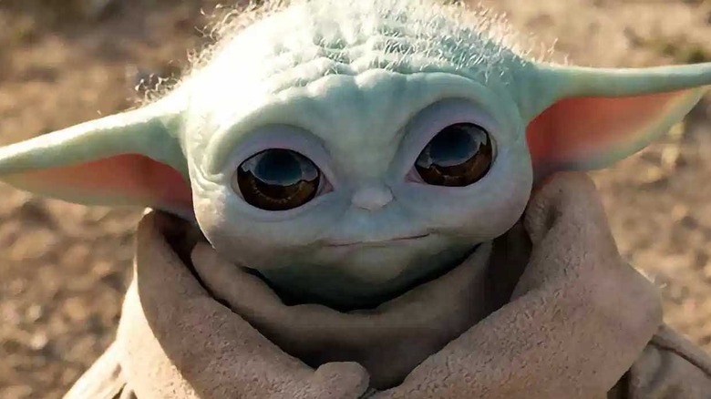 Baby Yoda looking up
