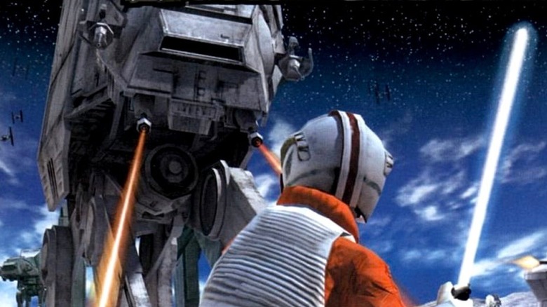 Luke Skywalker faces an AT-AT with his lightsaber drawn on the cover art for Star Wars Rogue Squadron III: Rebel Strike