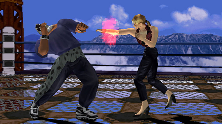 Nina punches King in the face in Tekken 3