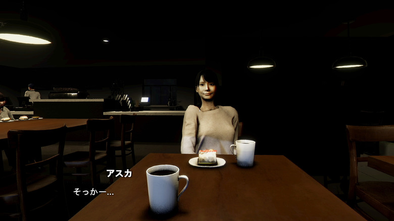 A woman stares at the player while sitting with a cup of coffee and pastry in Parasocial