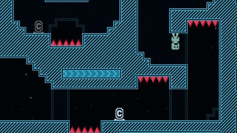 Captain Viridian stands frowning while on the ceiling by red spikes in VVVVVV
