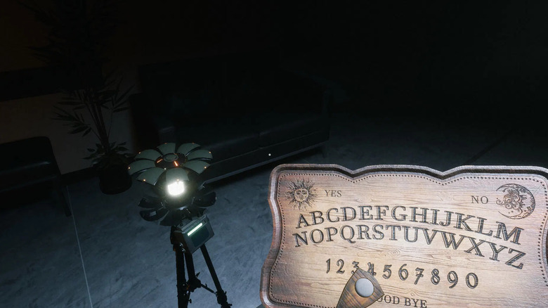 A player character uses a Ouija board by a ghost detector in Ghost Watchers