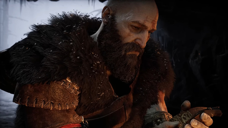 Kratos sitting by the fire
