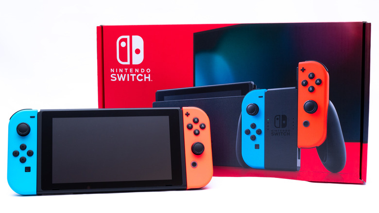 Nintendo Switch in front of box