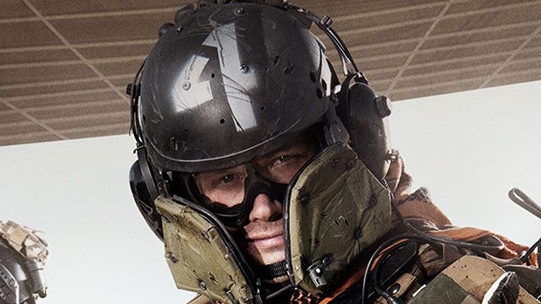 Operator standing in cargo bay of plane