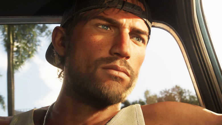 Jason Duval is seen in closeup as he sits in a car in Grand Theft Auto 6