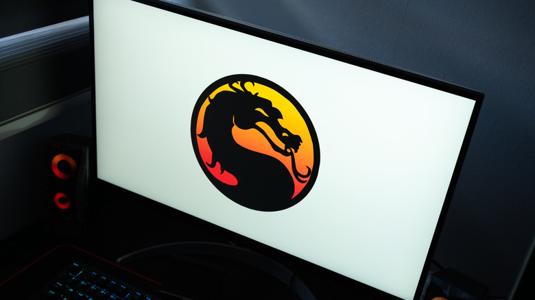 Dark room with Mortal Kombat on TV