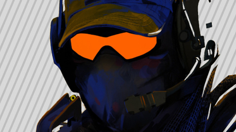 Soldier wearing cap and glowing orange goggles
