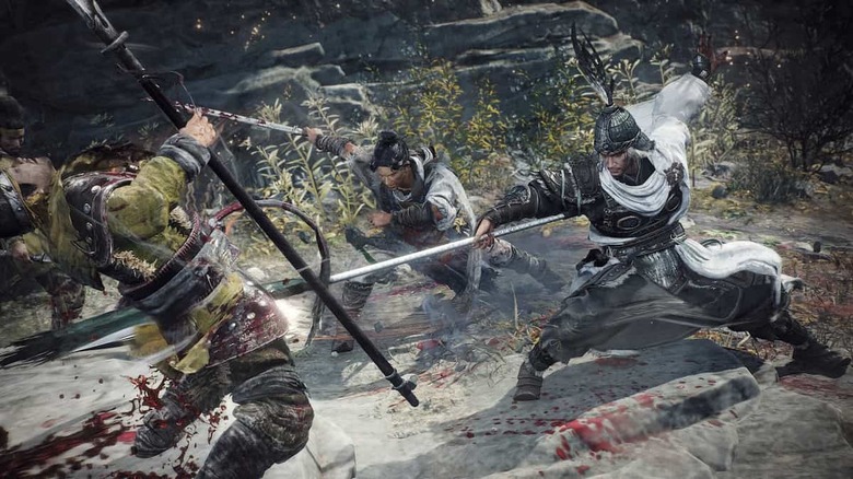 Two soldiers attacking a third