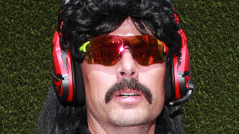 Dr Disrespect in front of hedge