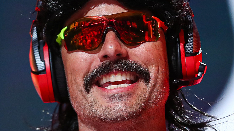 Dr. Disrespect smiling at podium