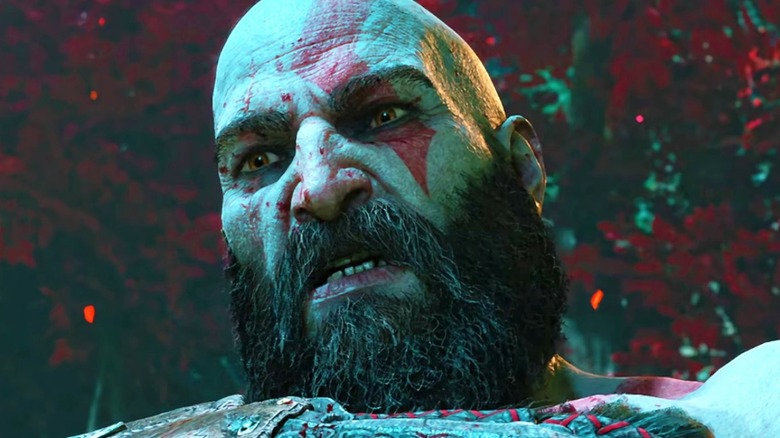 Kratos grimaces as he looks down in this still from the Ragnarok trailer