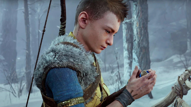 Atreus looking at the magic soul stone