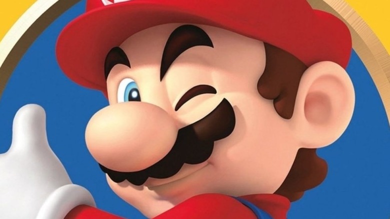 Mario winks and thumbs up