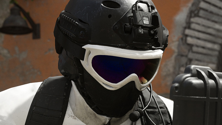 Closeup white ski goggles soldier