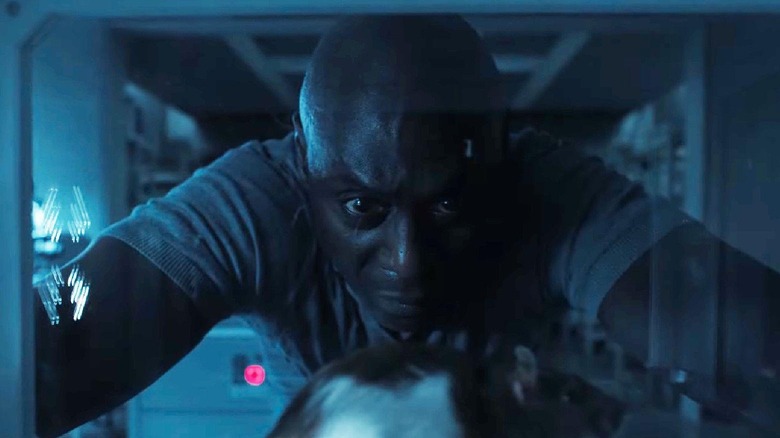 Lance Reddick Resident Evil looking at a mouse