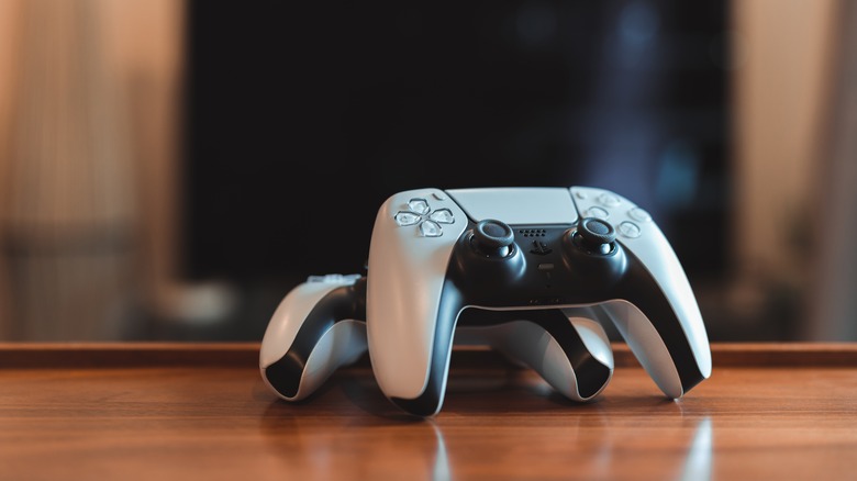 PS 5 controllers in front of TV