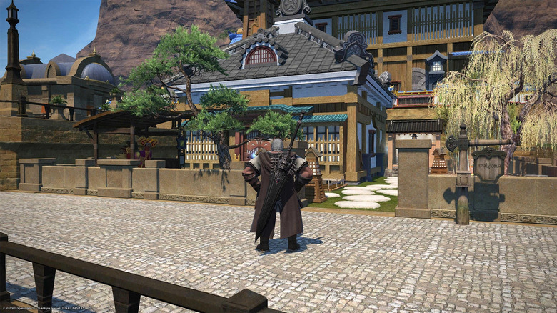 Character standing in front of house