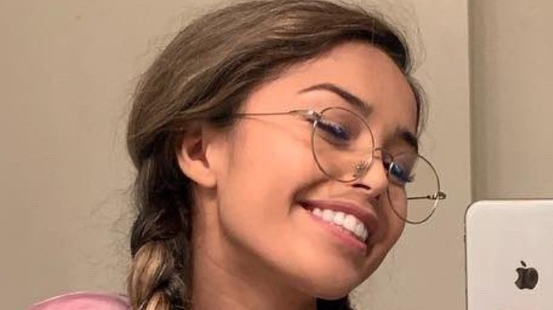 Valkyrae in glasses smiling