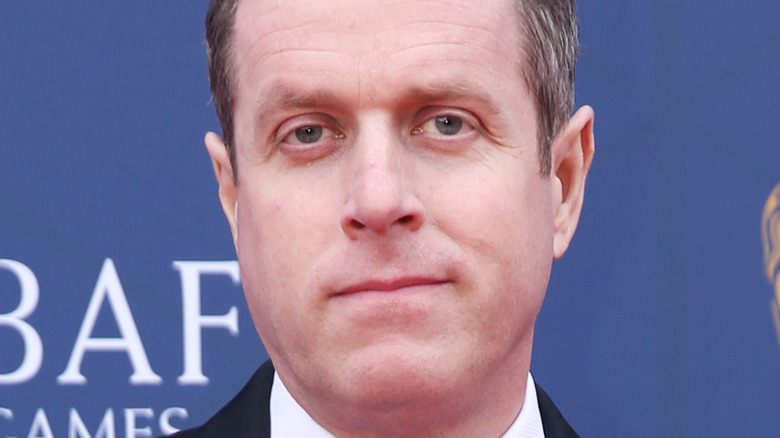 Geoff Keighley posing at BAFTA Game Awards