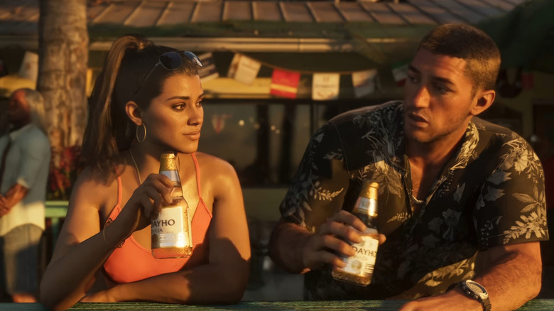Lucia and Jason sitting together drinking beers in a screenshot of Grand Theft Auto 6 (2026)