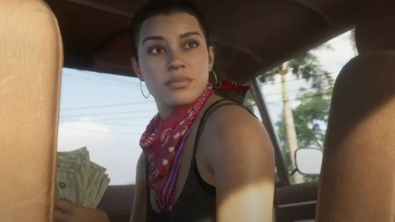 A woman in a car holding money from Grand Theft Auto VI