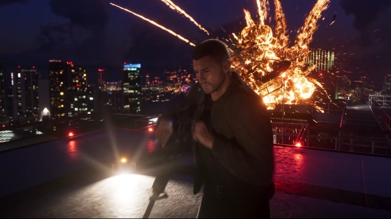 Jason standing in front of an exploding helicopter on a roof