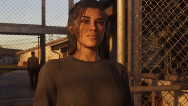 Lucia standing outside prison gates in "GTA 6"