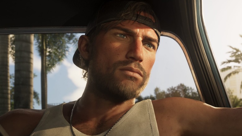 Jason, in backwards cap, looks somber in a vehicle in Grand Theft Auto VI