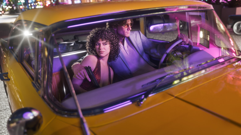Jason puts his arm around Lucia as they ride in a car in Grand Theft Auto 6