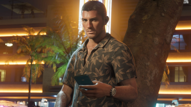 Jason leaning against a tree holding a phone in Grand Theft Auto 6
