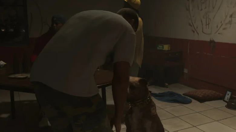 Jason petting a dog in GTA VI