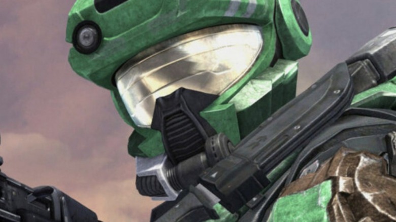 Green Spartan brandishes rifle