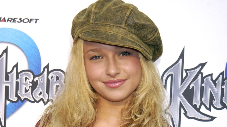 Hayden Panettiere in a hat and red jacket at a Kingdom Hearts event